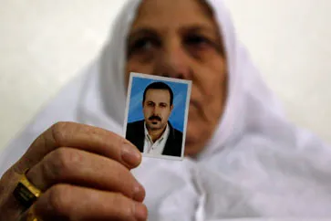 Mother of murdered Hamas member Mahmoud al-Mabhouh shows photo