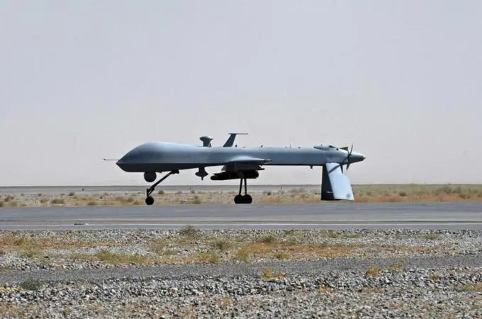 File photo of U.S. Predator unmanned drone armed with a missile on the tarmac of Kandahar military airport