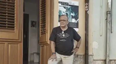 Giovanni Impastato at his anti-mafia association Casa Memoria Peppino e Felicia Impastato in central Cinisi, Sicily [Eileen Quinn/Al Jazeera]