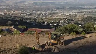 Workers at the place were Federico Garcia Lorca's remains are believed to be as the search of his body starts in Granada, Spain [EPA]