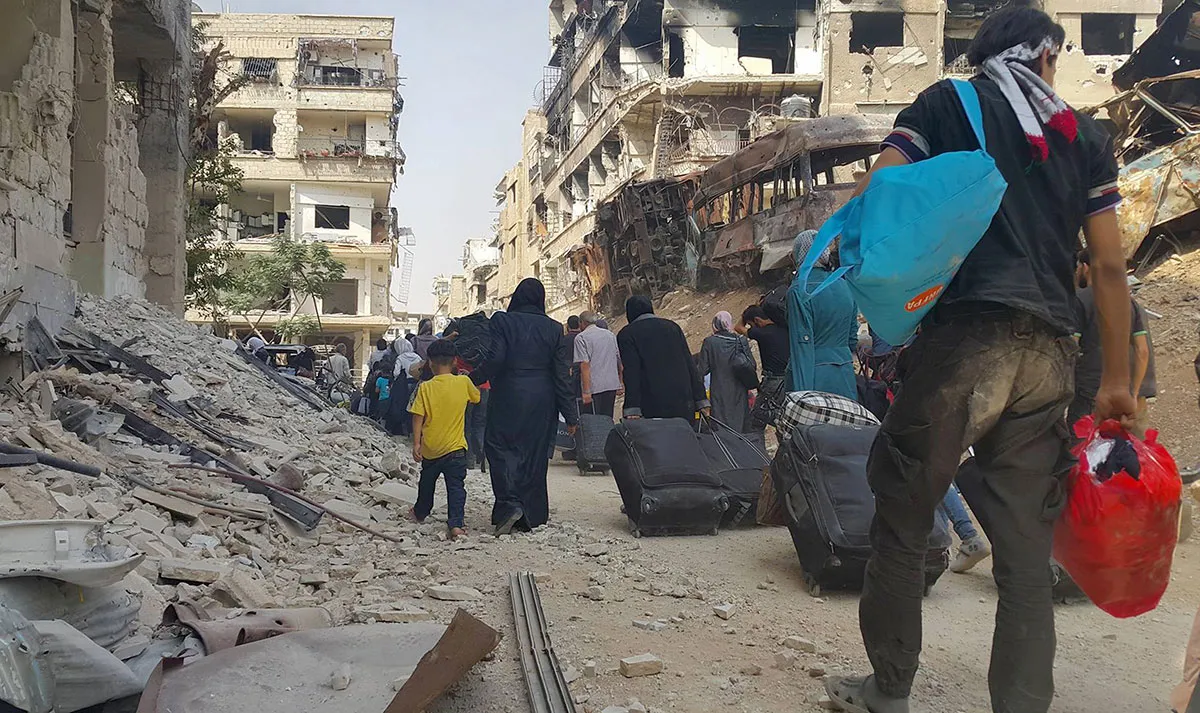 
As the uprising devolved into conflict, Assad began exploiting another popular narrative by presenting himself as the supposed protector of Syria's minorities [Local Council of Daraya City via AP]
