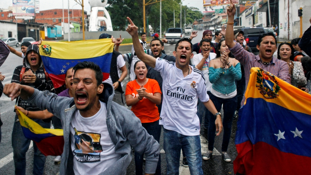 Opposition supporters shout slogans during a protest against Venezuelan President Nicolas Maduro''s government in San Cristobal