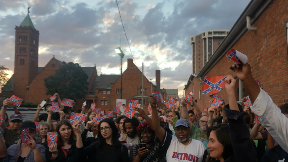 More than 70 people attended the Confederate flag burning held at the N’Namdi Center for Contemporary Art in Detroit on Memorial Day [Kurt Nagl/Al Jazeera]