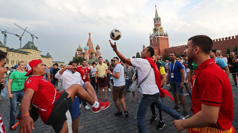 Fans play football on the Red Square in central Moscow, Russia