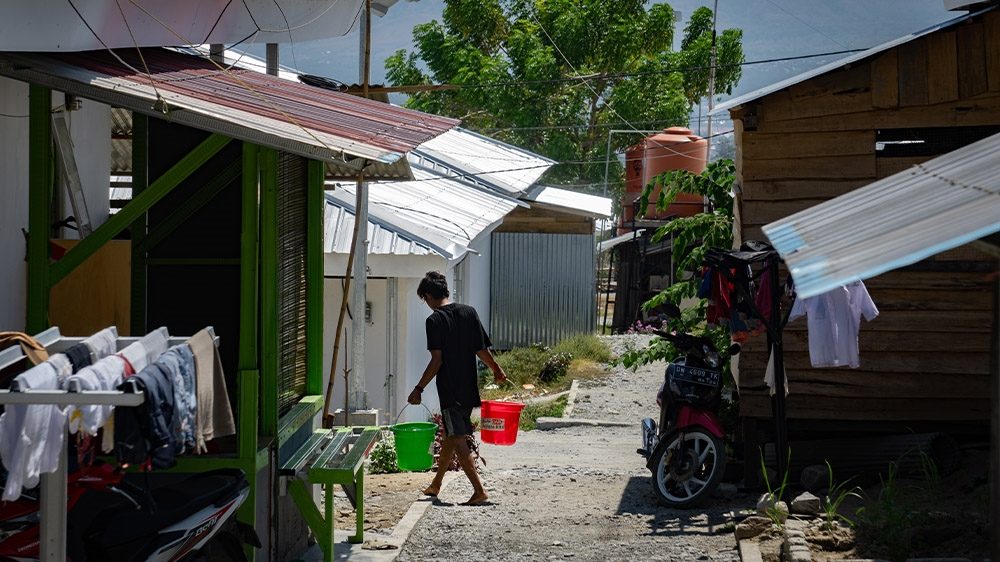 The temporary homes where many people in Palu moved after the twin disasters are beginning to look more permanent