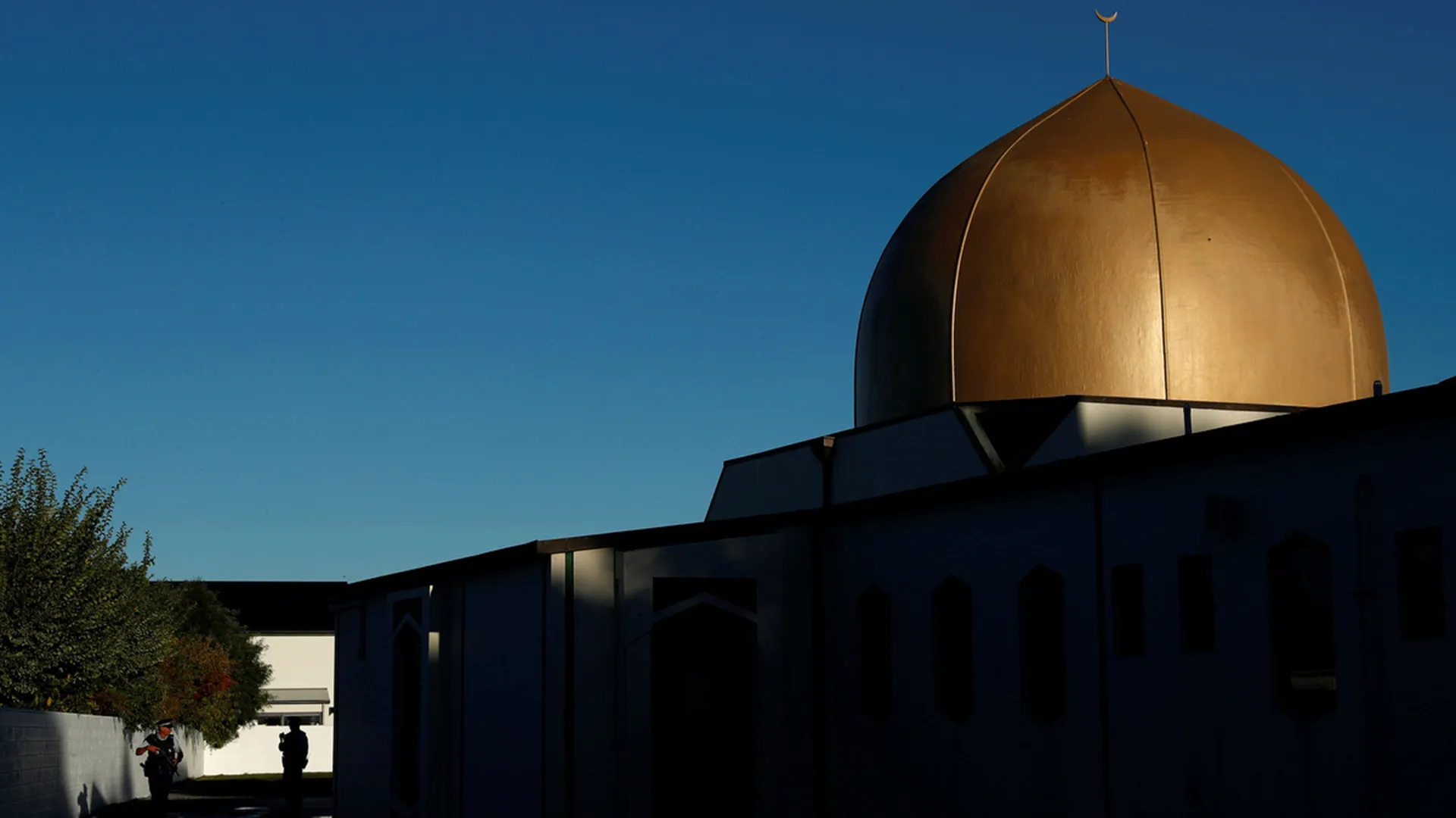 Armed police officers stand guard outside Al Noor mosque on April 1, 2019