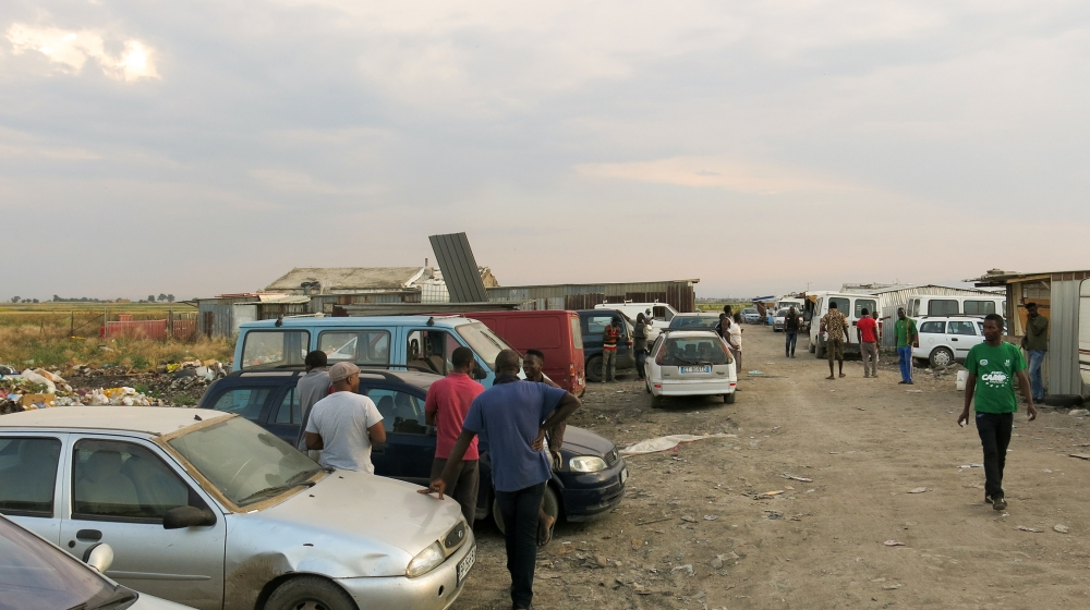 Workers are seen in Localita Torretta Antonacci, ex-shantytown of Rignano. Thousands live here during the harvest seasons