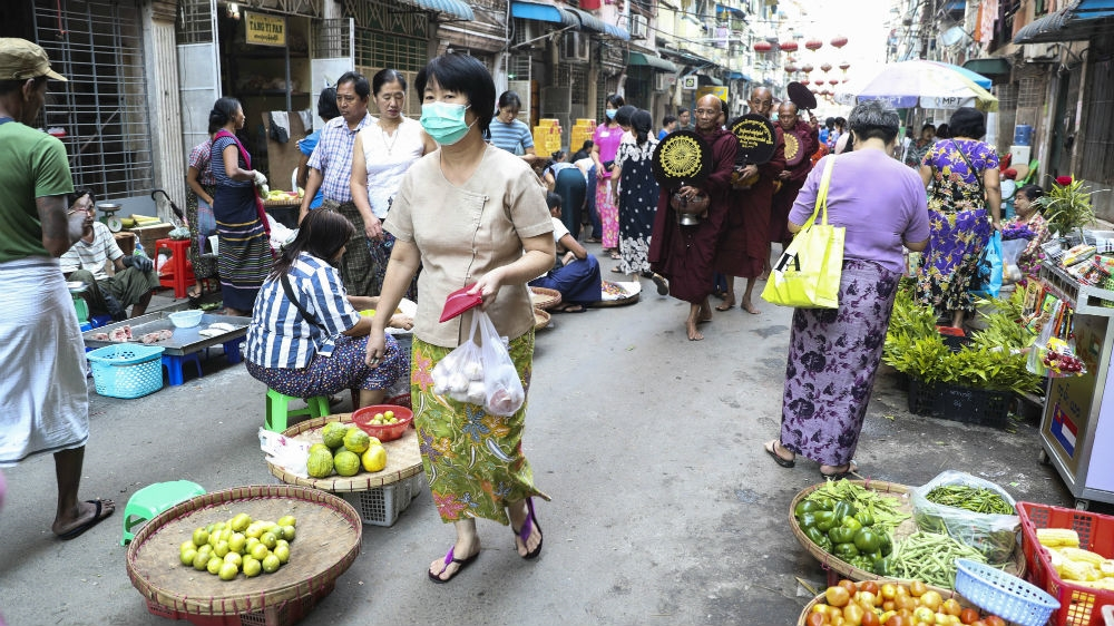 A woman shops at a local bazaar in Yangon, Myanmar’s commercial capital, in March 2020