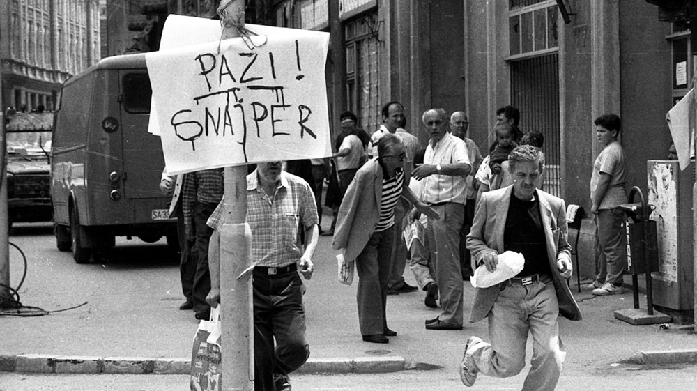 A sign in Sarajevo warns pedestrians crossing the streets: ‘Watch out! Sniper!’