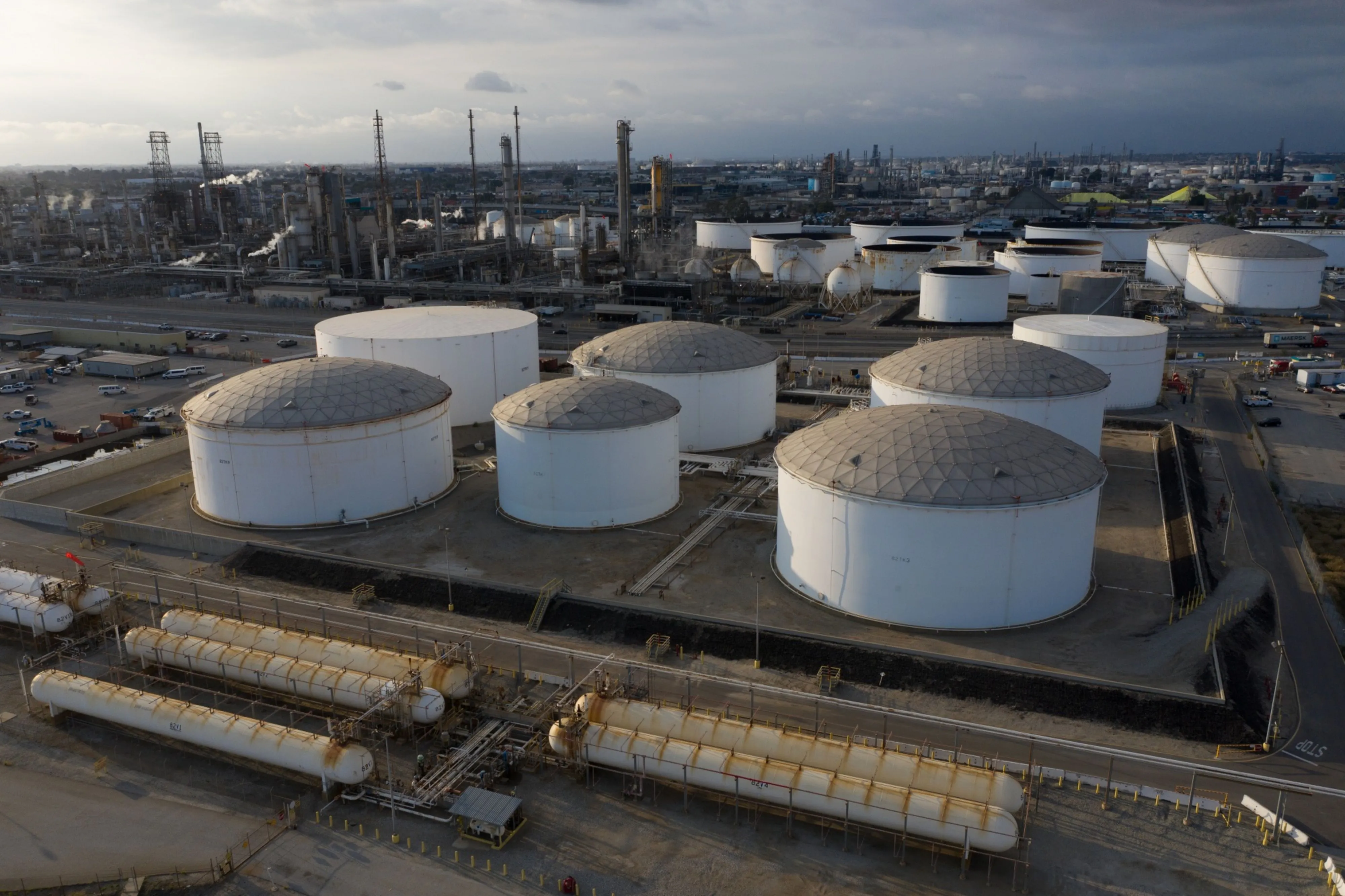 Crude futures' decline pushed the benchmark to close below its 50-day moving average for the first time since late April, a bearish signal that may invite more sellers into the market [File: Bing Guan/Bloomberg]