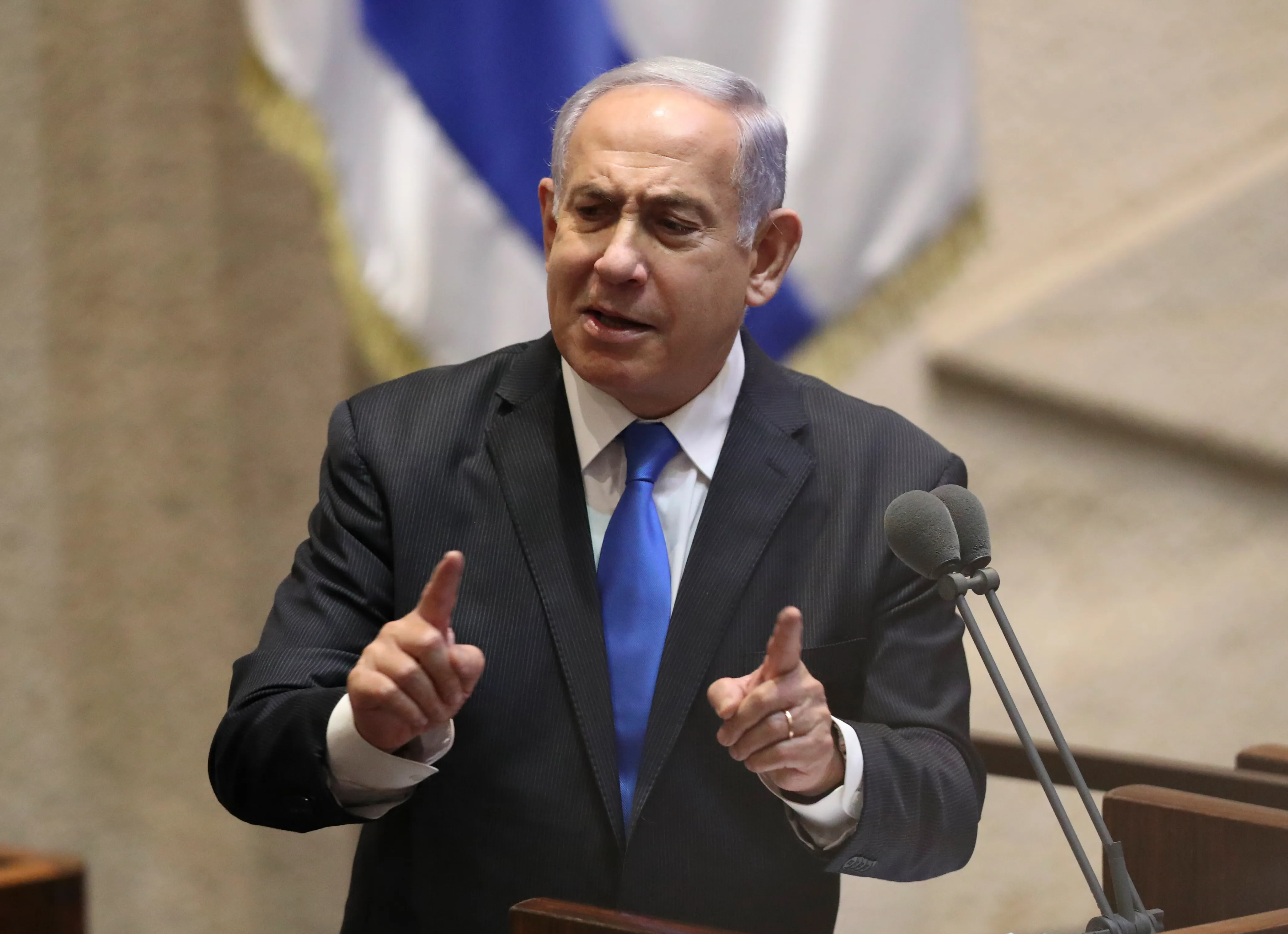 Israeli PM Benjamin Netanyahu speaks at a podium
