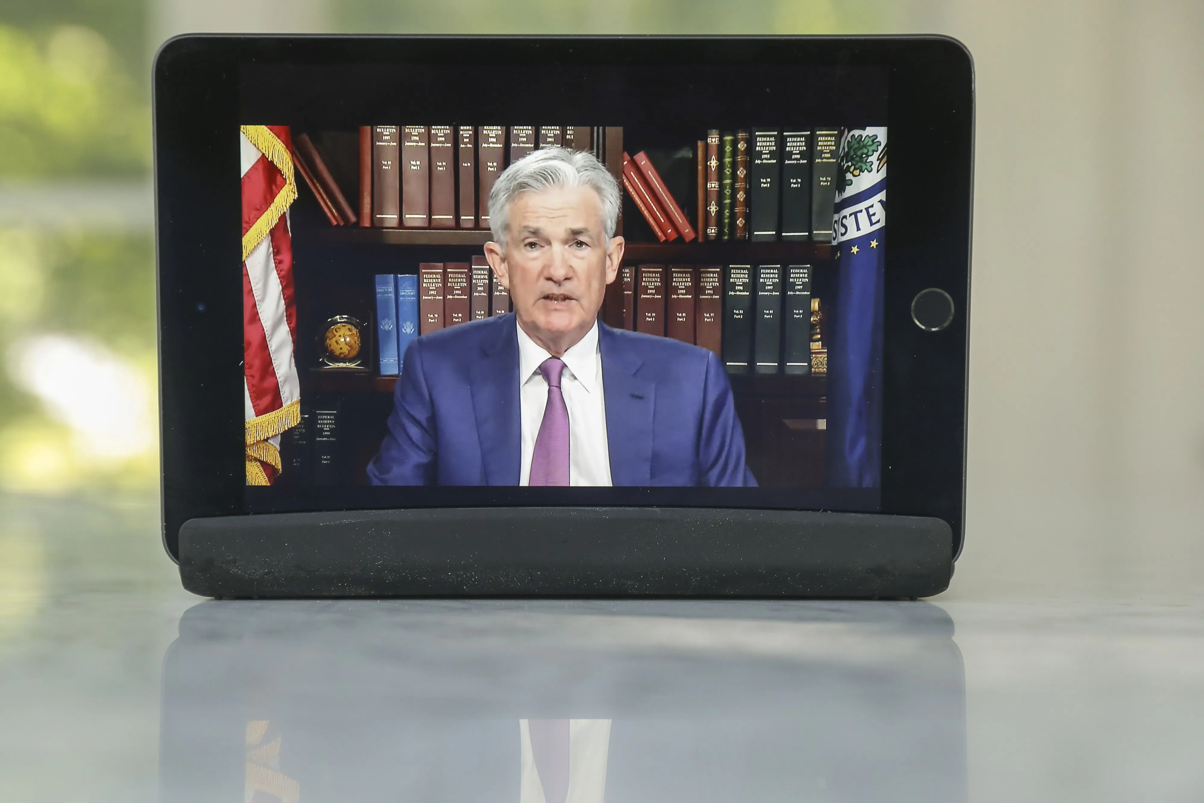 United States Federal Reserve Chairman Jerome Powell delivered his remarks virtually Friday after a surge in COVID-19 cases near the planned symposium site in Jackson Hole, Wyoming forced organisers to scrap in-person plans [File: Daniel Acker/Bloomberg]
