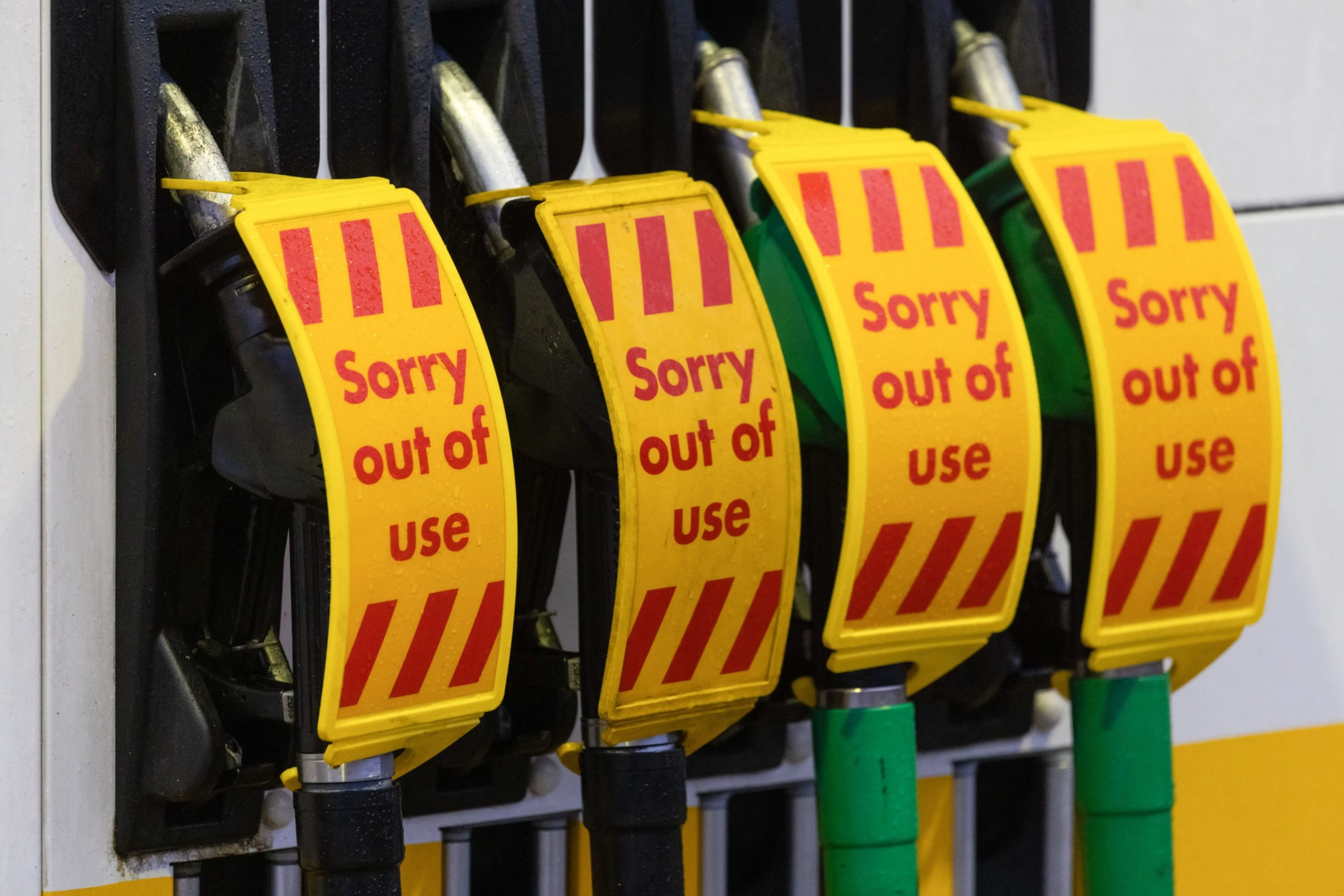 Covers on fuel pumps reading "Sorry out of use" at a Royal Dutch Shell Plc petrol station near Guildford, U.K., on Monday, Sept. 27, 2021. The U.K. government took emergency measures late Sunday to try to ease acute fuel shortages across the country, as gasoline retailers shut pumps after days of panic buying. Photographer: Jason Alden/Bloomberg